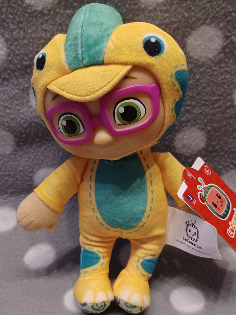 CoComelon Plüschfigur „Bella im Dinosaurier-Kostüm“ – Kuschelfigur, 19 cm